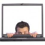 flirty business man appearing on laptop